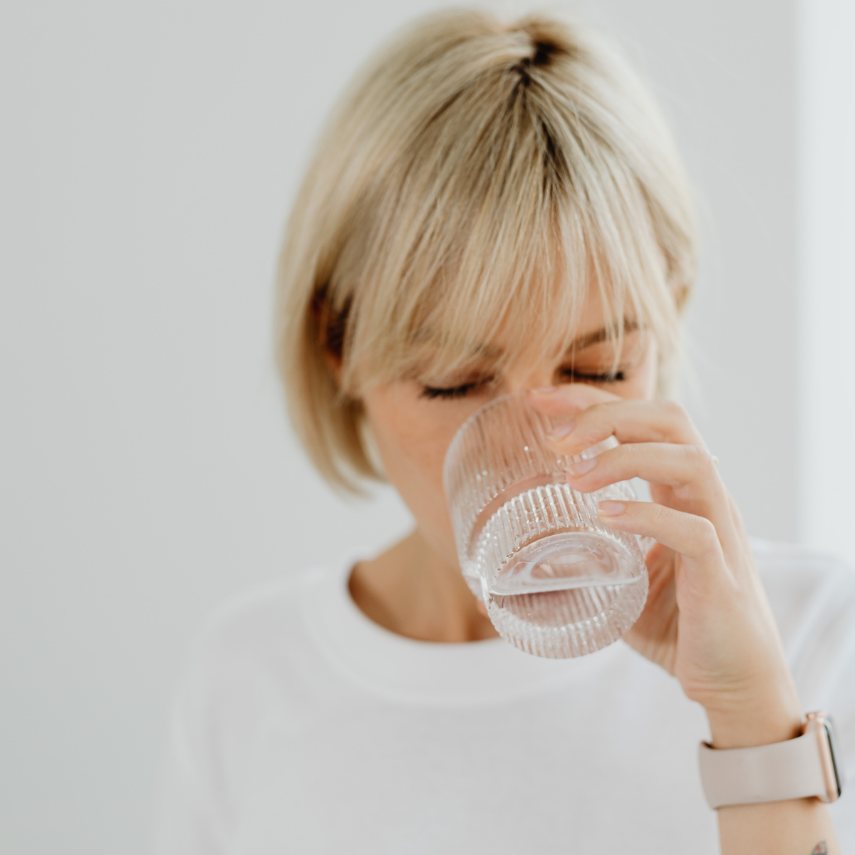 Woman drinking Mineral Rich Water in the morning