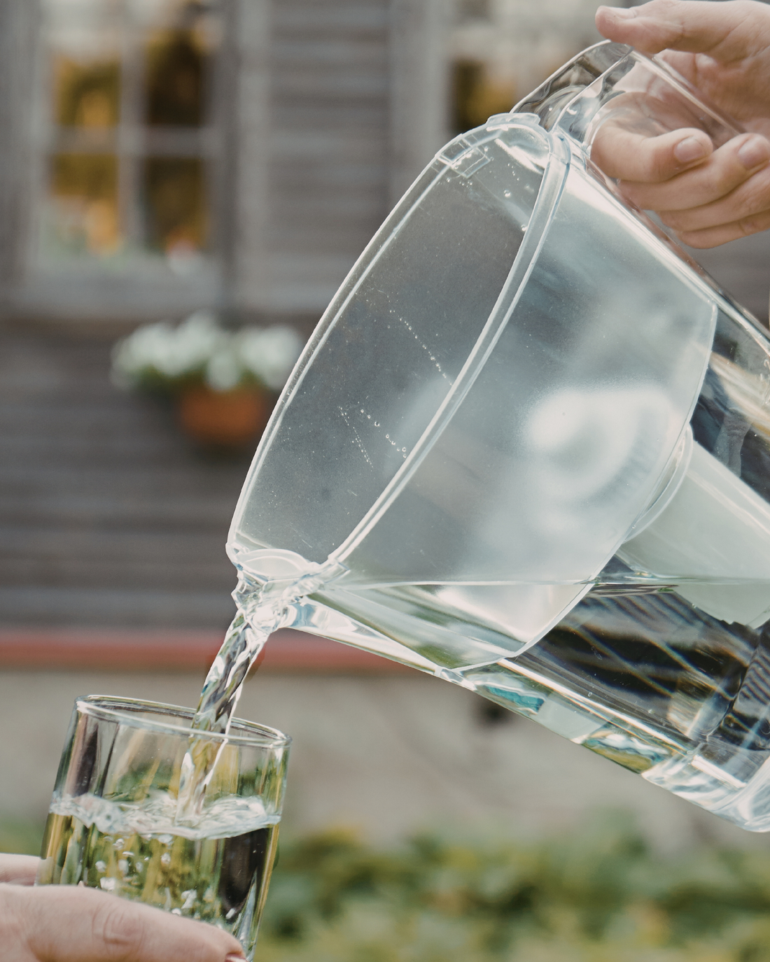 Glass of clean filtered water representing PJURE vs Brita comparison for European households.