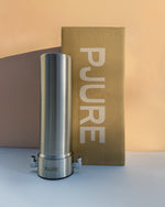 Stainless steel water filter with PJURE branding on a beige background
